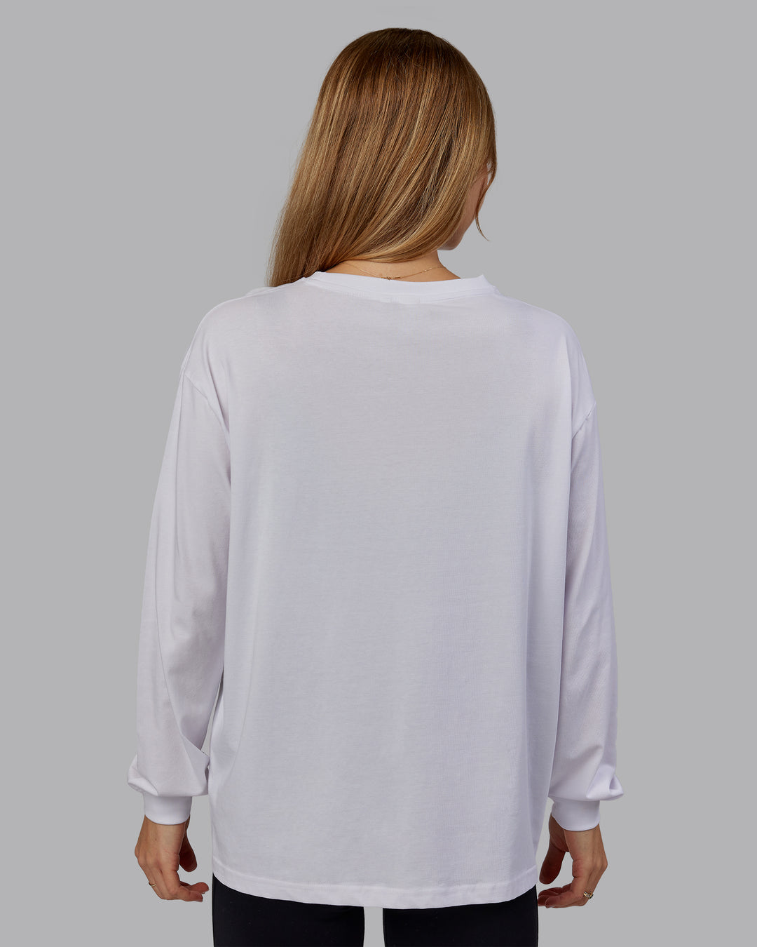 Woman wearing Go-To Long Sleeve FLXCotton Oversized Tee - White-Black | Model:Emilie | Size:S - view 3