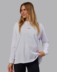 Woman wearing Go-To Long Sleeve FLXCotton Oversized Tee - White-Black | Model:Emilie | Size:S | Thumbnail Index: 0
