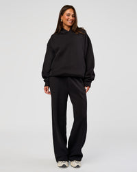 Woman wearing Go-To Oversized Hoodie - Black | Model:Bianca | Size:S | Thumbnail Index: 1