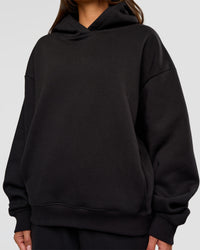Woman wearing Go-To Oversized Hoodie - Black | Model:Bianca | Size:S | Thumbnail Index: 3