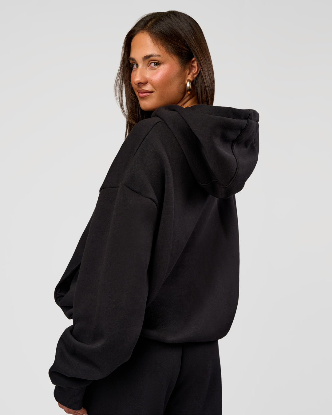 Woman wearing Go-To Oversized Hoodie - Black | Model:Bianca | Size:S - view 3