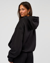 Woman wearing Go-To Oversized Hoodie - Black | Model:Bianca | Size:S | Thumbnail Index: 2