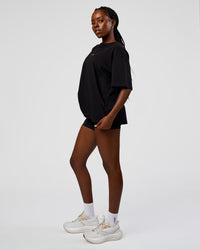 Woman wearing Go-To Run Club FLXCotton Oversized Tee - Black-Marshmallow | Model:Ellie | Size:S | Thumbnail Index: 2