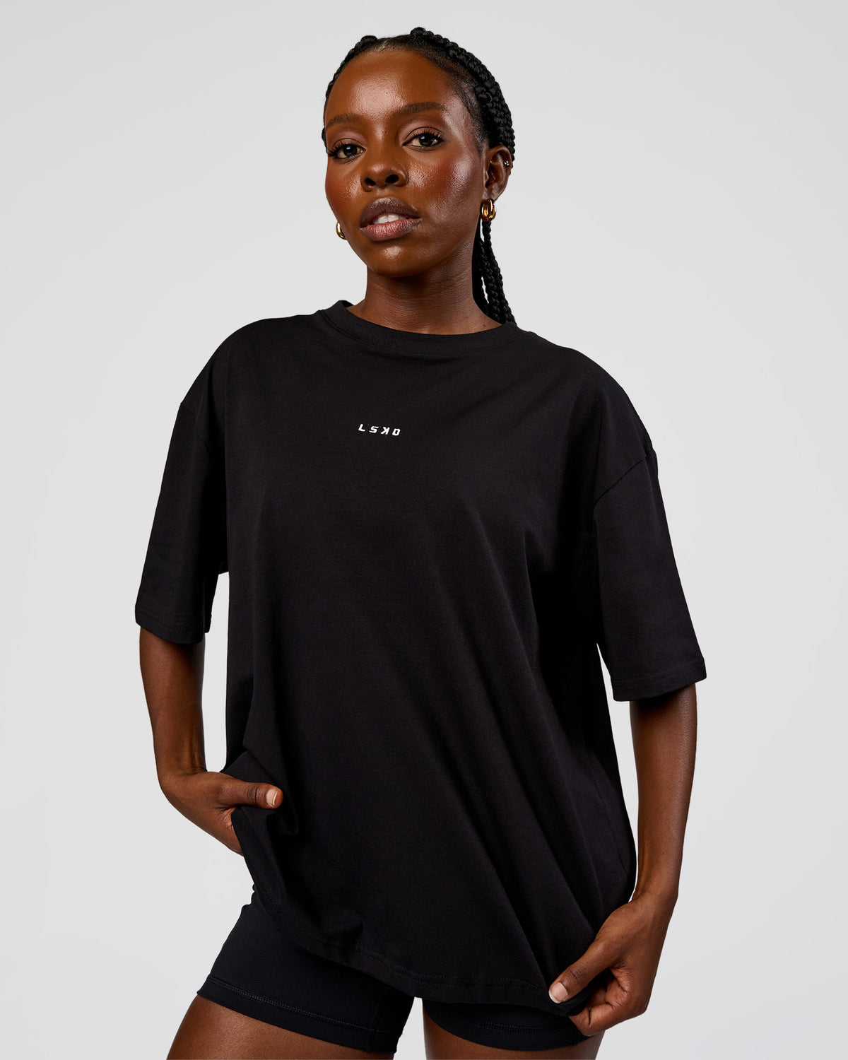 Woman wearing Go-To Run Club FLXCotton Oversized Tee - Black-Marshmallow | Model:Ellie | Size:S