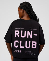 Woman wearing Go-To Run Club FLXCotton Oversized Tee - Black-Marshmallow | Model:Ellie | Size:S | Thumbnail Index: 0