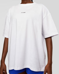 Woman wearing Go-To Run Club FLXCotton Oversized Tee - White-Electric Indigo | Model:Ellie | Size:S | Thumbnail Index: 3