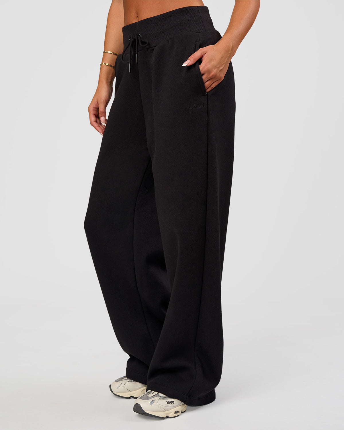 Woman wearing Go-To Wide Leg Track Pant - Black | Model:Bianca | Size:S