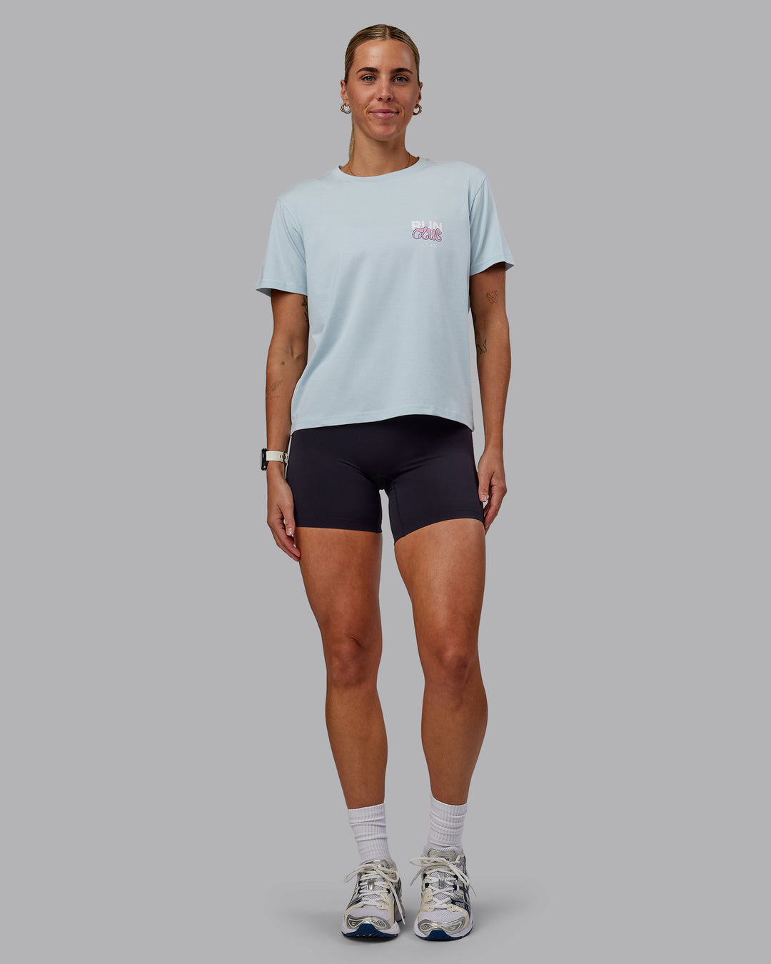 Woman wearing Gone Running FLXCotton Tee - Skyride-Bubblegum - view 5