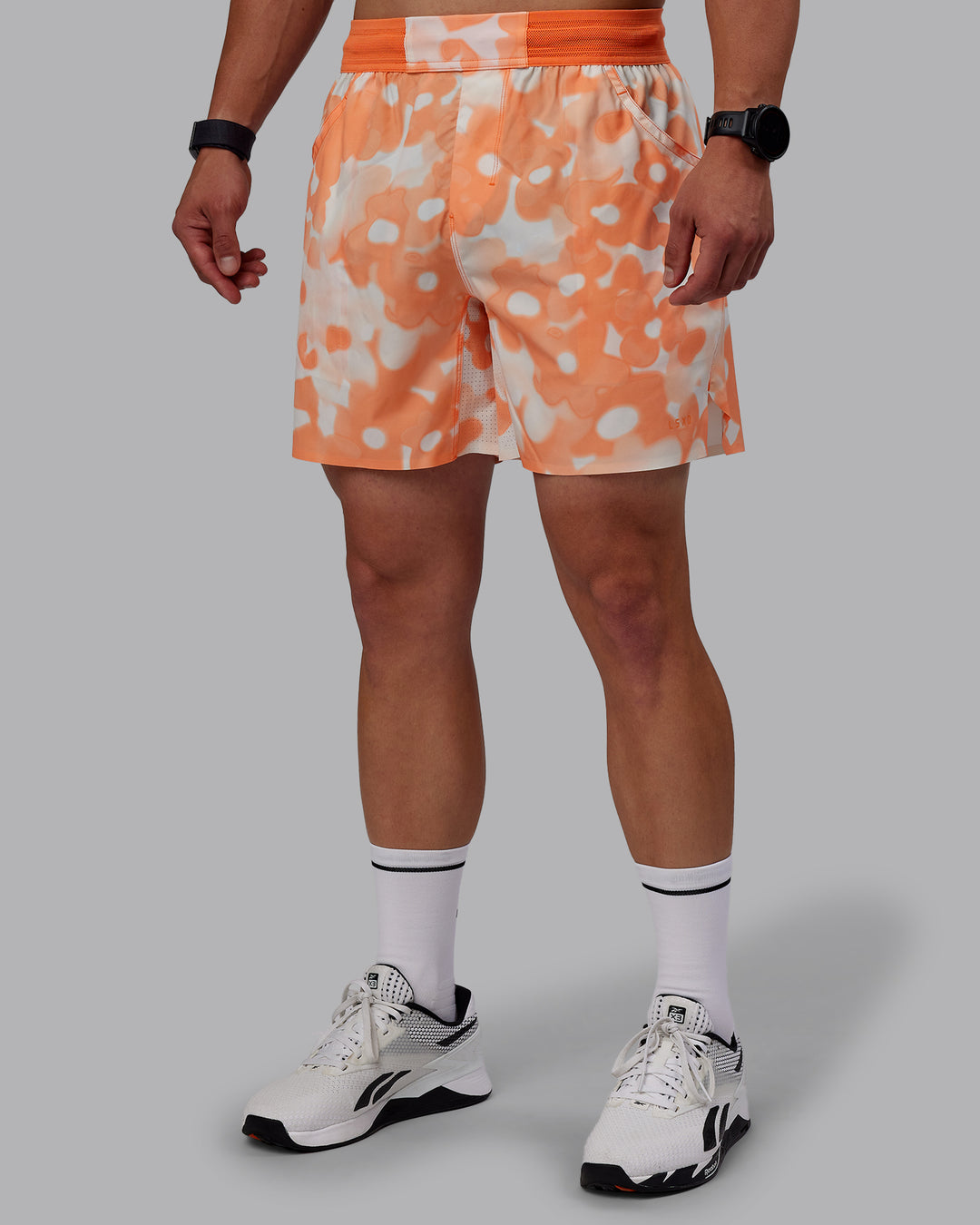  Man wearing Grand Slam 6" Shorts in Wildflower Cantaloupe | Size:S - view 11
