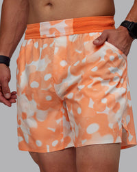 Man wearing Grand Slam 6" Shorts in Wildflower Cantaloupe | Size:S | Thumbnail Index: 9