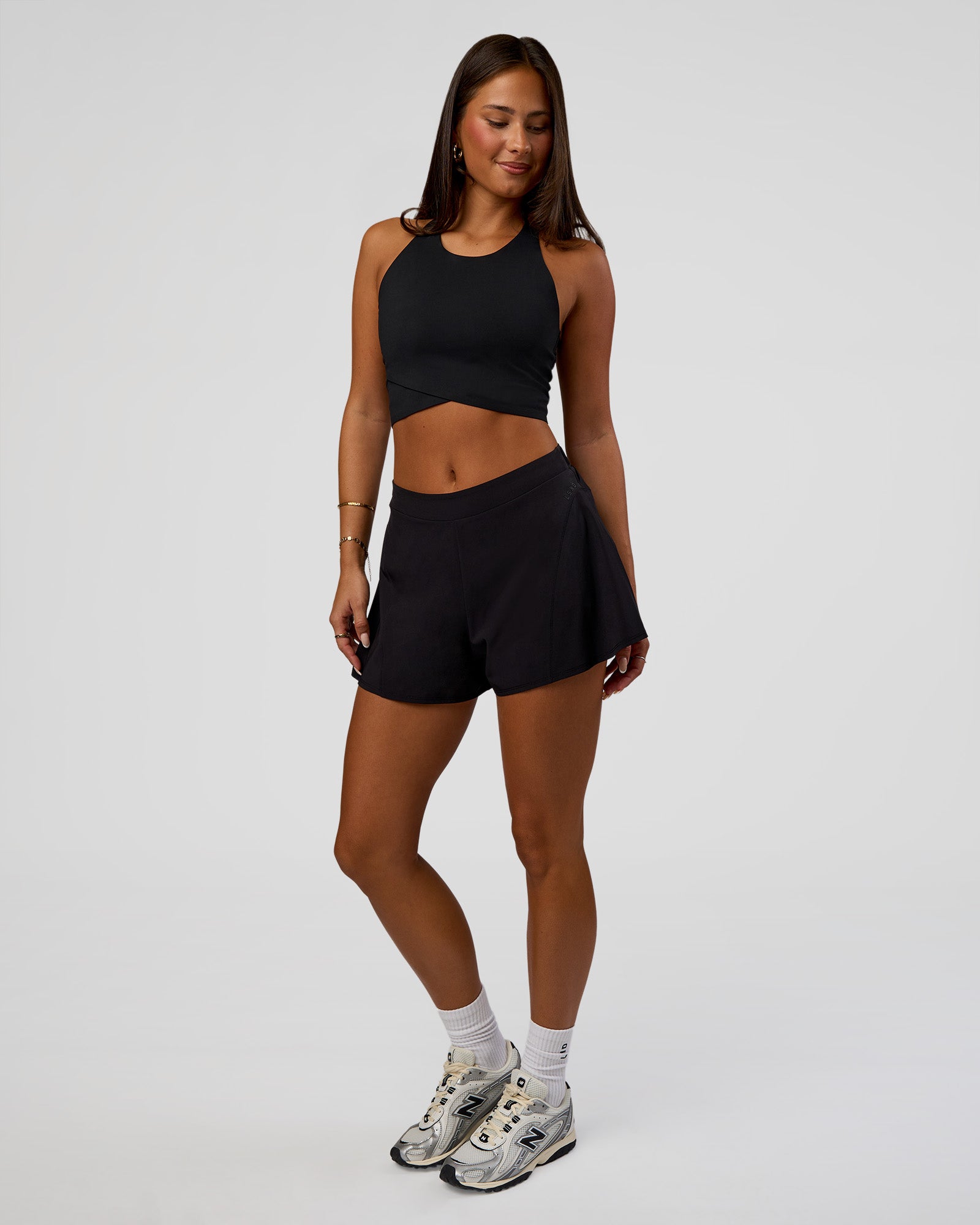 Woman wearing Hybrid Performance Crossover Tank - Black | Model:Bianca | Size:S