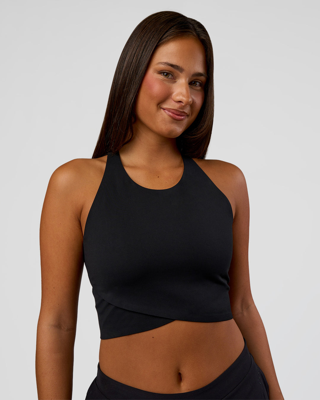 Woman wearing Hybrid Performance Crossover Tank - Black | Model:Bianca | Size:S - view 1