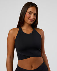 Woman wearing Hybrid Performance Crossover Tank - Black | Model:Bianca | Size:S | Thumbnail Index: 0