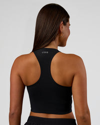 Woman wearing Hybrid Performance Crossover Tank - Black | Model:Bianca | Size:S | Thumbnail Index: 2