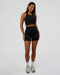 Woman wearing Hybrid Performance Crossover Tank - Black | Model:Bianca | Size:S | Thumbnail Index: 5
