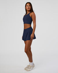 Woman wearing Hybrid Performance Crossover Tank - Future Navy | Model:Bianca | Size:S | Thumbnail Index: 2
