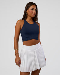 Woman wearing Hybrid Performance Crossover Tank - Future Navy | Model:Bianca | Size:S | Thumbnail Index: 0