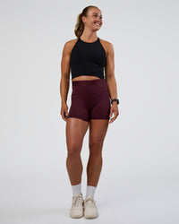 Woman wearing Ignite High Neck Tank - Black | Model:Sav | Size:S | Thumbnail Index: 5