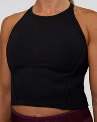 Woman wearing Ignite High Neck Tank - Black | Model:Sav | Size:S | Thumbnail Index: 4