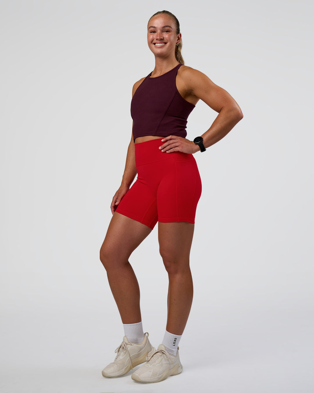 Woman wearing Ignite High Neck Tank - Cherry Lacquer | Model:Sav | Size:S - view 5
