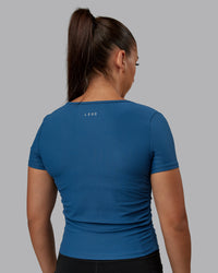 Woman wearing Ignite Ribbed Scrunch Side Cropped Tee - Indigo | Size:S | Model:Tylah | Thumbnail Index: 2