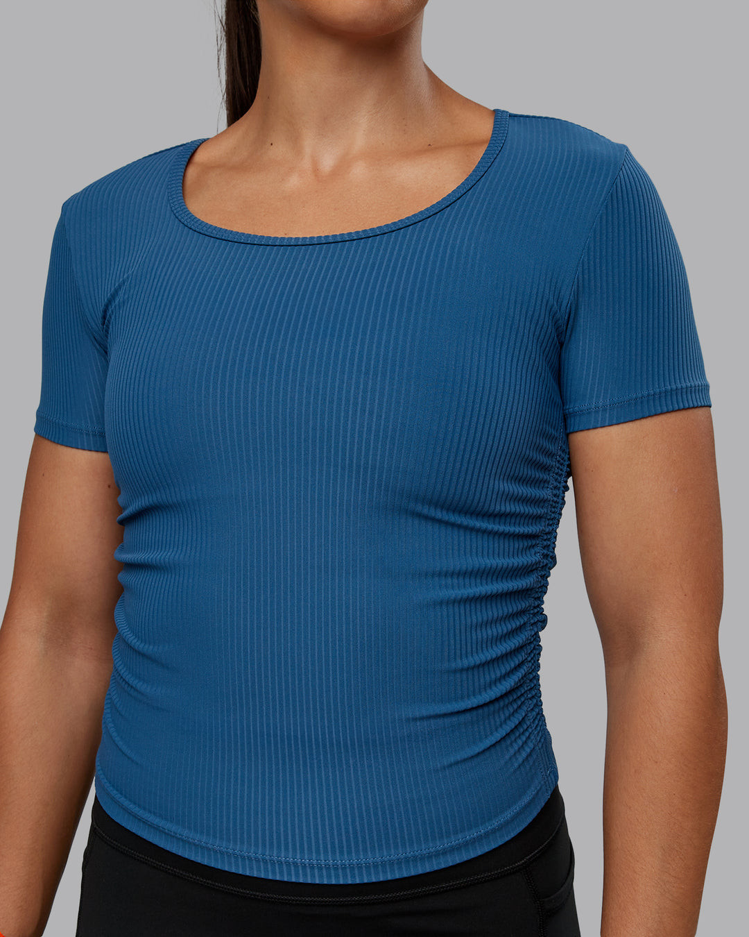 Woman wearing Ignite Ribbed Scrunch Side Cropped Tee - Indigo | Size:S | Model:Tylah - view 4