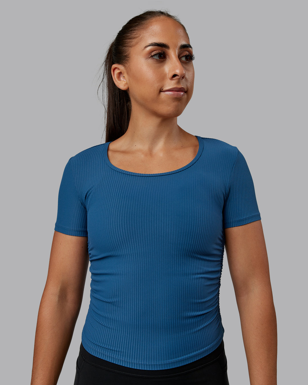 Woman wearing Ignite Ribbed Scrunch Side Cropped Tee - Indigo | Size:S | Model:Tylah - view 1