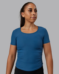 Woman wearing Ignite Ribbed Scrunch Side Cropped Tee - Indigo | Size:S | Model:Tylah | Thumbnail Index: 0