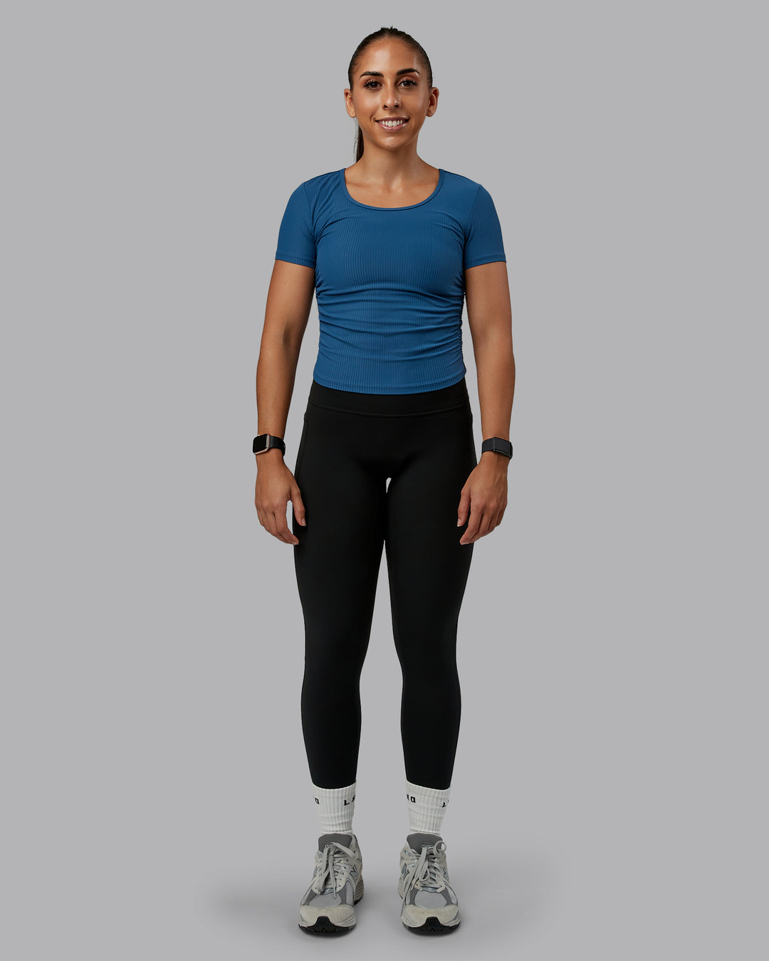 Woman wearing Ignite Ribbed Scrunch Side Cropped Tee - Indigo | Size:S | Model:Tylah - view 2