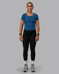 Woman wearing Ignite Ribbed Scrunch Side Cropped Tee - Indigo | Size:S | Model:Tylah | Thumbnail Index: 1