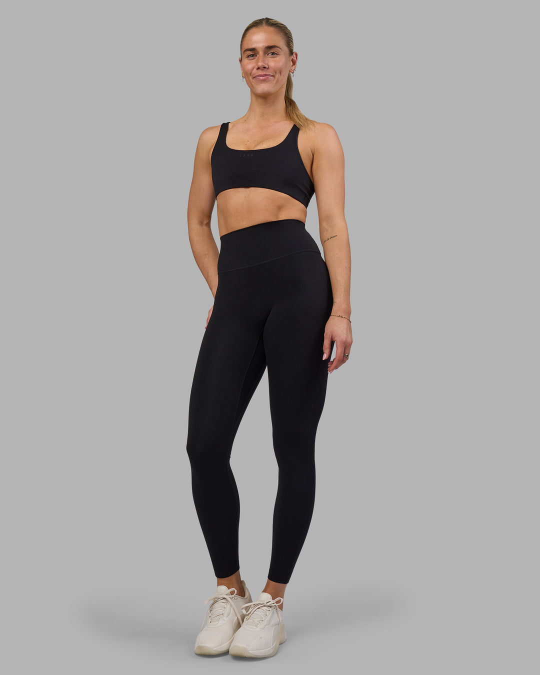 Woman wearing Impulse Reversible Sports Bra - Black | Model:Hannah | Size:S - view 3