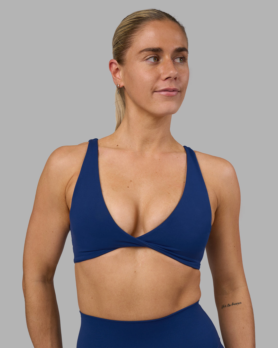 Woman wearing Impulse Reversible Sports Bra - Midnight Blue | Model:Hannah | Size:S - view 1