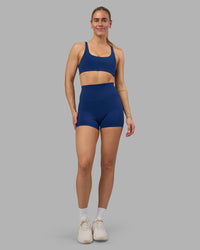 Woman wearing Impulse Reversible Sports Bra - Midnight Blue | Model:Hannah | Size:S | Thumbnail Index: 4