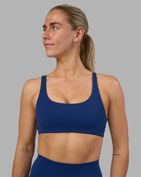 Woman wearing Impulse Reversible Sports Bra - Midnight Blue | Model:Hannah | Size:S | Thumbnail Index: 7