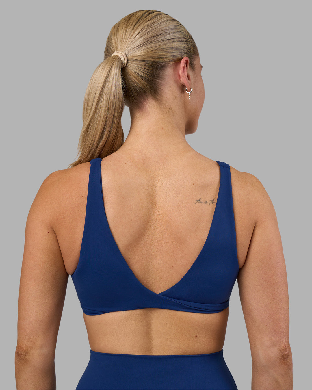 Woman wearing Impulse Reversible Sports Bra - Midnight Blue | Model:Hannah | Size:S - view 6