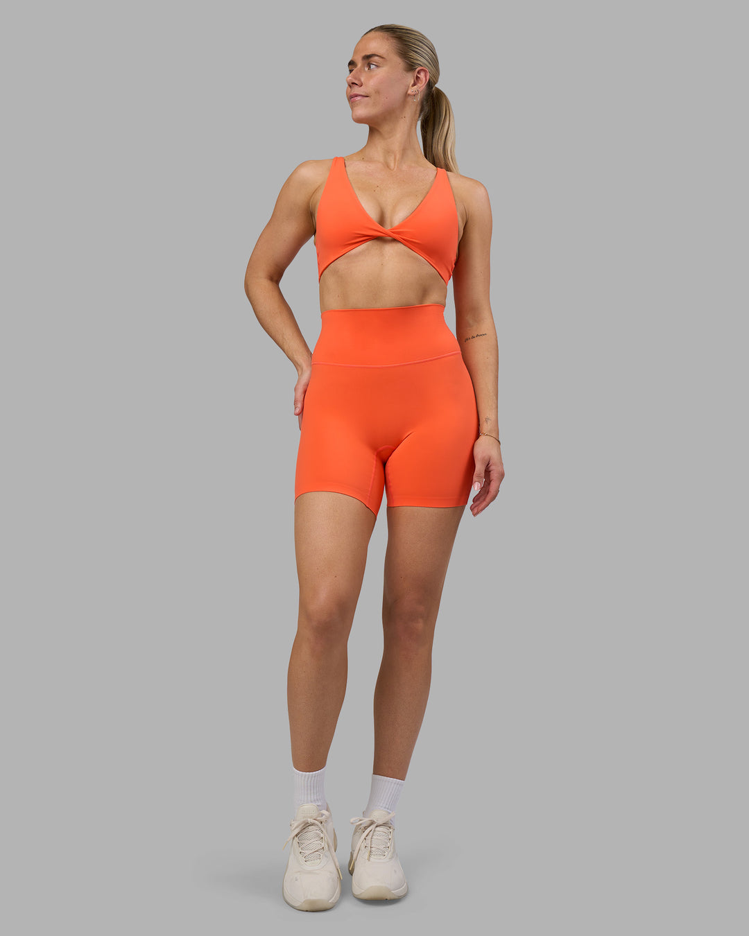 Woman wearing Impulse Reversible Sports Bra - Ultra Orange | Model:Hannah | Size:S - view 7