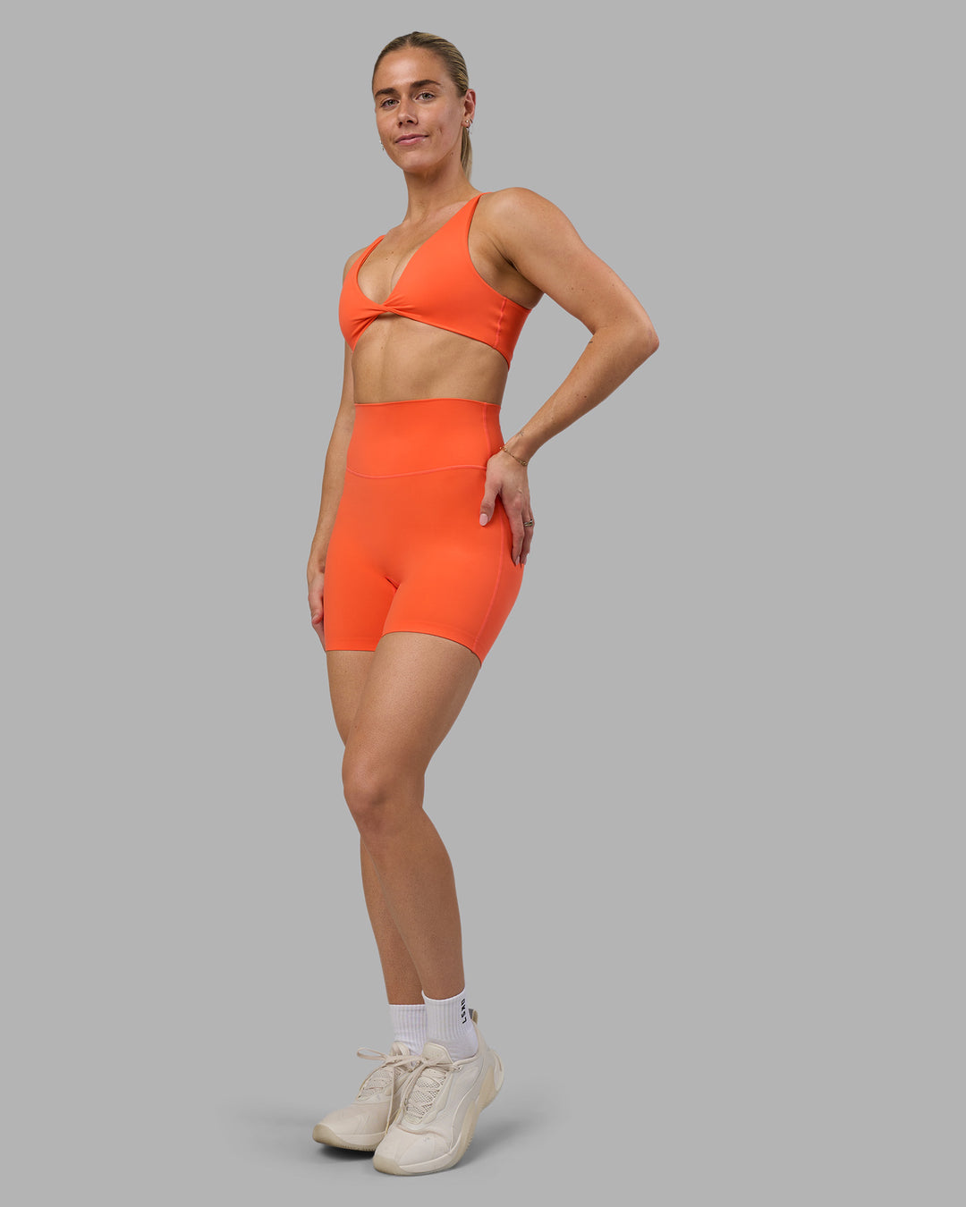 Woman wearing Impulse Reversible Sports Bra - Ultra Orange | Model:Hannah | Size:S - view 5