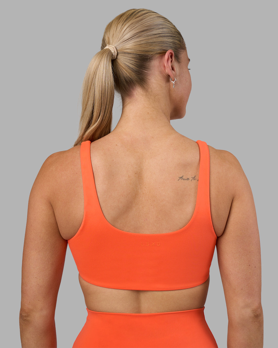 Woman wearing Impulse Reversible Sports Bra - Ultra Orange | Model:Hannah | Size:S - view 4