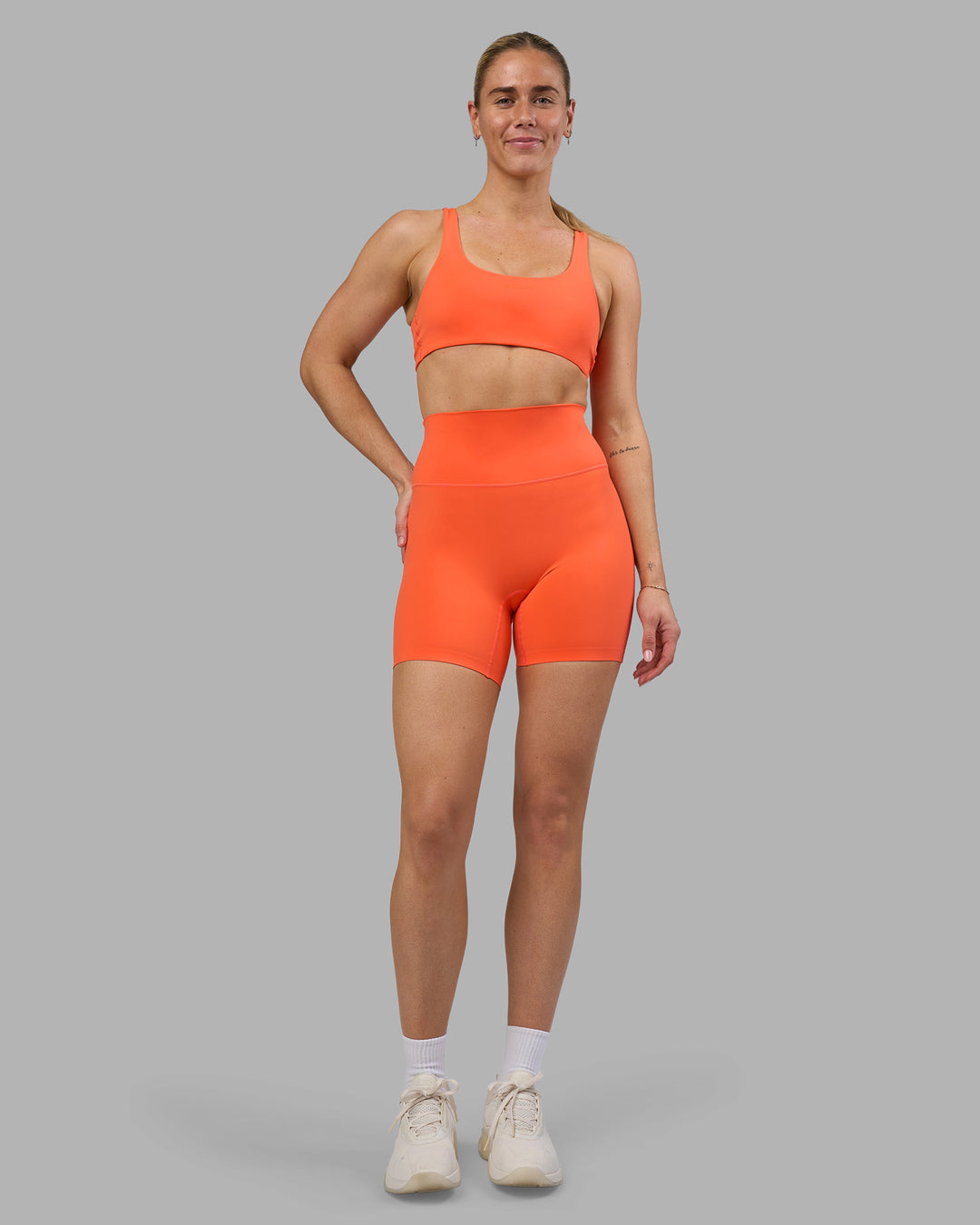 Woman wearing Impulse Reversible Sports Bra - Ultra Orange | Model:Hannah | Size:S - view 8
