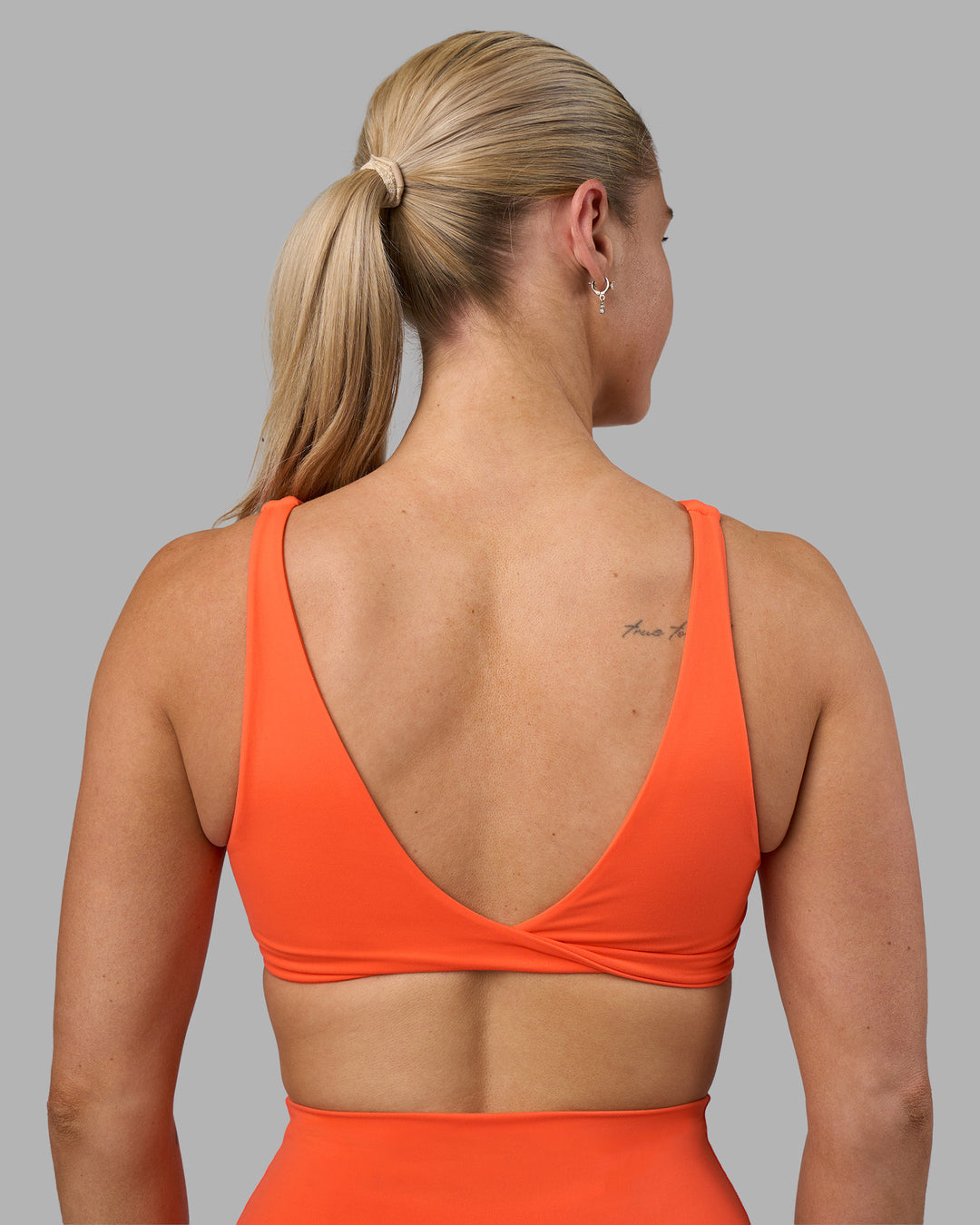 Woman wearing Impulse Reversible Sports Bra - Ultra Orange | Model:Hannah | Size:S - view 10
