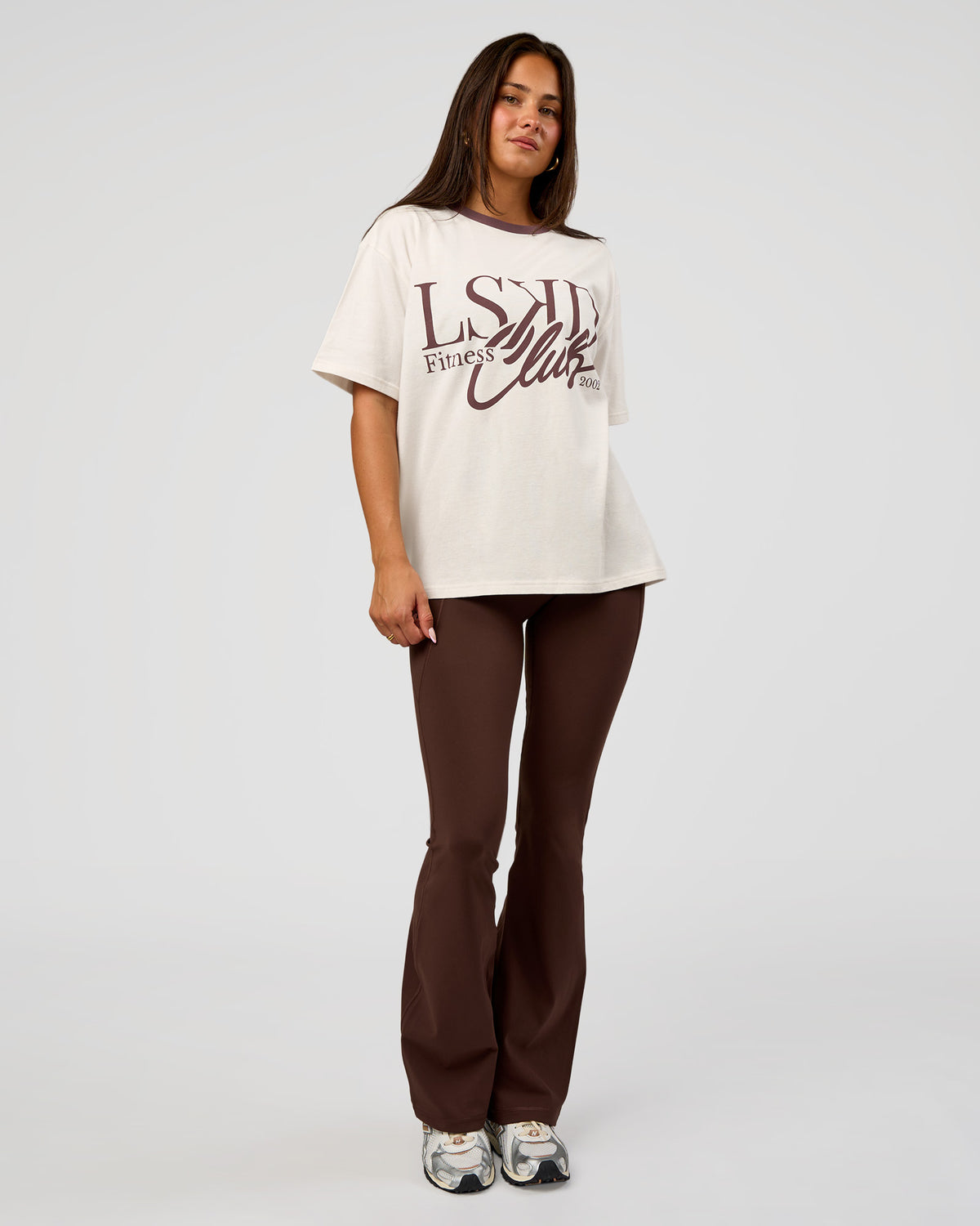 Woman wearing LSKD Fitness Club Heavyweight Oversized Tee - Off White-Cocoa Powder | Model:Bianca | Size:S