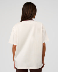 Woman wearing LSKD Fitness Club Heavyweight Oversized Tee - Off White-Cocoa Powder | Model:Bianca | Size:S | Thumbnail Index: 2