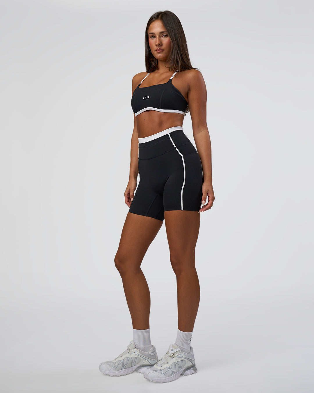 Woman wearing Liberate Contrast High-Rise 6" Short Pockets - Black-White | Model:Bianca | Size:S - view 5