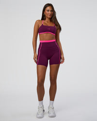 Woman wearing Liberate Contrast High-Rise 6" Short Pockets - Plum Caspia-Ultra Pink | Model:Bianca | Size:S | Thumbnail Index: 4