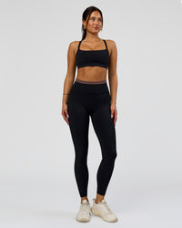 Woman wearing Liberate High-Rise Full Length Legging Pockets in Black-Cocoa Powder | Model:Bianca | Size:S | Thumbnail Index: 2