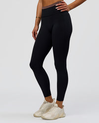 Woman wearing Liberate High-Rise Full Length Legging Pockets in Black-Cocoa Powder | Model:Bianca | Size:S | Thumbnail Index: 6