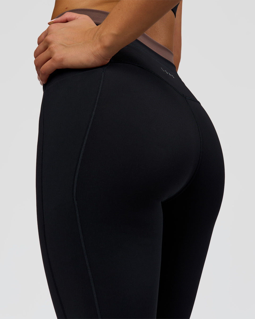 Woman wearing Liberate High-Rise Full Length Legging Pockets in Black-Cocoa Powder | Model:Bianca | Size:S - view 8