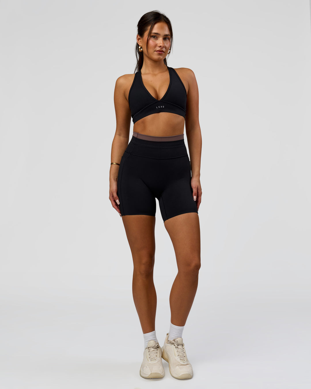 Woman wearing Liberate High-Rise 6" Short Pockets in Black-Cocoa Powder | Model:Bianca | Size:S - view 3