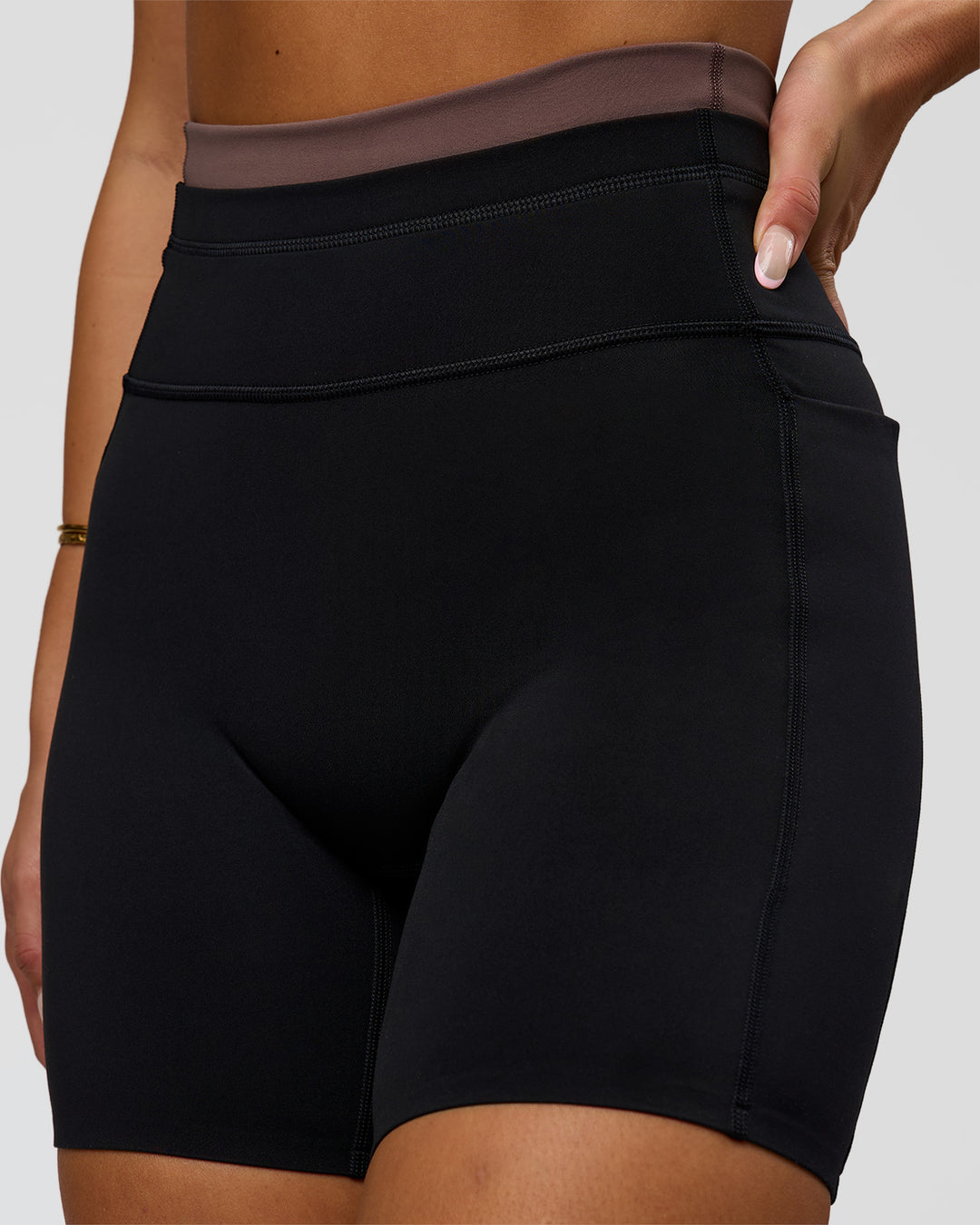 Woman wearing Liberate High-Rise 6" Short Pockets in Black-Cocoa Powder | Model:Bianca | Size:S - view 6