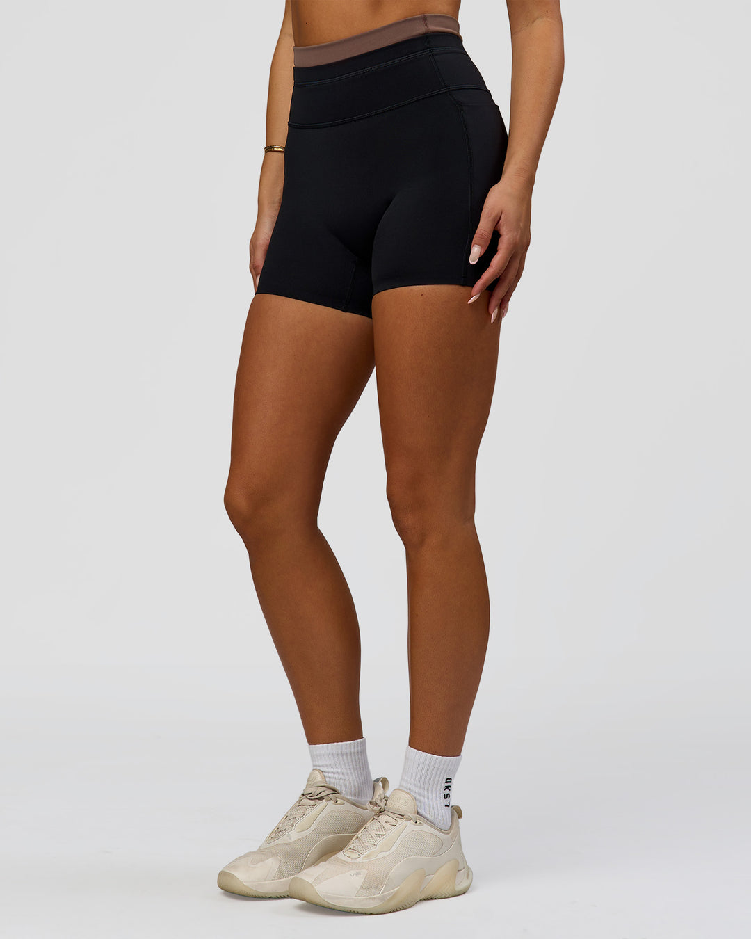 Woman wearing Liberate High-Rise 4" Short Pockets in Black-Cocoa Powder | Model:Bianca | Size:S - view 8
